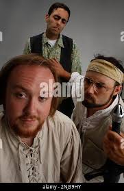 Actors clockwise from front--Pete Lynch plays The Knave, Omied Far plays  Sir Daniel, and Steve Bologna plays Sir William in "Much Ado About  Lebrowski" in San Francisco, Calif.,