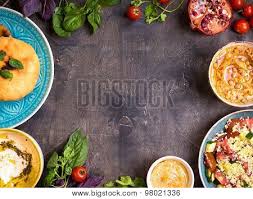 Traditionally made with chickpeas, this version swaps out cauliflower to lend a lighter mouthfeel. Table Served With Middle Eastern Traditional Vegetarian Dishes Hummus Tahini Pitta Couscous Salad And Buttermilk Dip With Olive Oil Dinner Party Poster Id 98021336