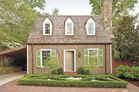 Real wood timber columns with black metal railings. 6 Jaw Dropping Curb Appeal Makeovers This Old House