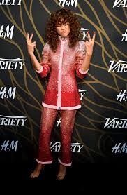 Photos Zendaya S Best Red Carpet Looks Outfits And Gowns Insider Zendaya poses for the camera while wearing a red shoulderless dress that highlights her jawline gracefully.