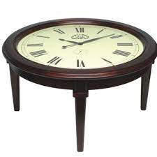 Most homemakers are already aware that a coffee table is a handy place to keep a book or magazine or two for example, a schooner coffee table with nested storage stools can add four padded seats to your living room, as well as provide space for games. Clock Coffee Table Collection Coffee Table Clock Wooden Table Top