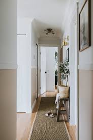 Taking the doors off a hall closet and turning it into an open space for a chest and artwork or a mirror fools the eye into believing an entry exists. Modern Narrow Hallway Makeover How To Transform A Dark Narrow Hallway With No Windows Into A Upscale And Modern Space With Little Money And Time Jessica Sara Morris