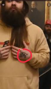 Alistair Coleman on Twitter: "There are claims that the bearded guy in this  photo inside the Capitol is Antifa because of his hand tattoo. It's the  Outsider's Mark from the 2012 video