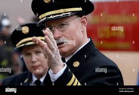 As San Francisco Fire Chief, Joanne Hayes-White looks on, Deputy Chief Pat  Gardner reports