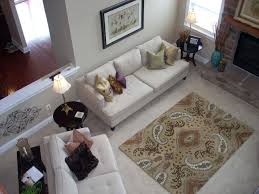 Use A Rug With Colors And Patterns Over A Neutral Carpet To Set The Tone For The Accents In The Room Living Room Carpet Rug Over Carpet Rugs On Carpet