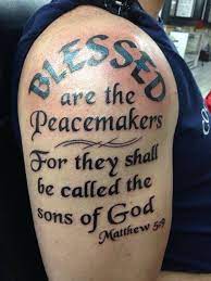 This tattoo covers the shoulder's part and half of the arm. Police Blessed Are The Peacemakers Tattoo