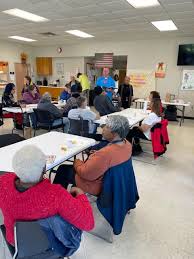 Bogalusa meal site enjoying group activity game time hosted by Bogalusa  WalMart Manger Kevin Wimer & Assistant Tiffany Ledet.