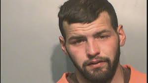 Police: Man dumping garbage down a street drain pulls knife