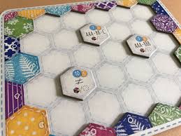 In the game players compete to create quilts which will score the the most points for colors, patterns, and the various cats it attracts. A Calico Scenario Of Quilts Cats And Buttons Gameward Bound