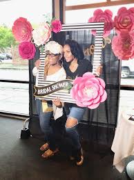 There are many backdrops which come to mind, but my favorite and the easiest suggestion is a paper flower backdrop. Everything Diy Paper Flowers Backdrop Selfie Frame Bridal Shower Backdrop Unique Bridal Shower Bridal Shower
