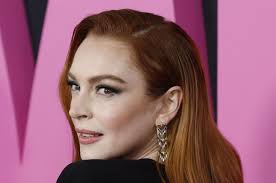 Look: Lindsay Lohan plays 'unlucky-in-love writer' in 'Irish Wish' photo