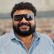 Who is the little girl with her grandmother in the photo?