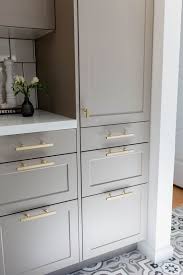 Cabinet and furniture hardware is a functional decorative detail. Light Gray Shaker Cabinets W Brass Hardware For Lowers Cabinetry Www Staceking Com Kitchencabinetsatikea Bauernhaus Stil Kuche Ikea Kuche Schrank Kuche