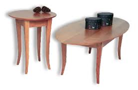 Some nice old distress in the top adds to the general character of the piece, although the highlight is truly the fabulous grain and warm patina. Cherrystone Furniture Flare Oval Coffee Table