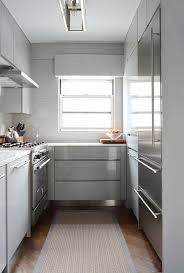 In this kitchen designed by dries otten, the gold mirrored surface brings some. Gray Modern Kitchens Modern Kitchen