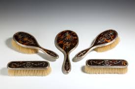 Want to discover art related to hairbrushes? Antique Silver And Tortoiseshell Brush Set