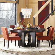 It is made of wooden materials finished in brown. Dining Room Designs Elegant Modern Chandelier Large Round Dining Room Tables Orange Chairs T Round Dining Room Table Dining Room Table Set Round Dining Table