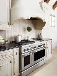 You can alter a range hood to either blend in with surrounding cabinets, match appliances or. Range Hood Ideas Kitchen Hood Design Kitchen Remodel Kitchen Hoods