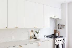 Kitchen Of The Week An Ikea Kitchen With An Elegant Upper Cabinet Solution Remodelista Ikea Kitchen White Ikea Kitchen White Glossy Kitchen