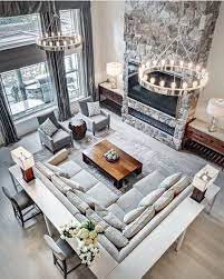 Large great room with modern sofa set and other types of furniture, along with a modish kitchen set with elegant black center island with a white countertop. Top 70 Best Great Room Ideas Living Space Interior Designs Living Room Remodel Livingroom Layout Large Living Room