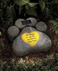The most common pet grave stone material is marble. This Solar Pet Memorial Statue Celebrates The Life Of Your Favorite Sidekick The Statue Charges In The S Pet Memorial Garden Pet Memorials Pet Memorial Stones