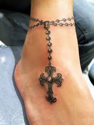 You can opt for a muted color like black or brown, or have the beads be different colors for this wrist tattoo. Rosary Tattoos Ideas Meaning Rosary Beads Tattoo Designs Tattoo Me Now