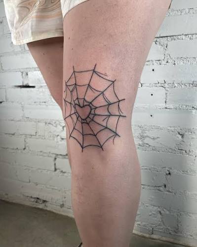 Spider web knee! With a cute heart in the center 🖤🖤🖤 #knee #kneetattoo # hearts #spiderweb #spiderwebtattoo #cute #stlouisartist #stlouis #stlartist #tattooartist #femaletattooartist #girlswithtattoos #tattoos #linetattoo # dotwork #deadsurestudio