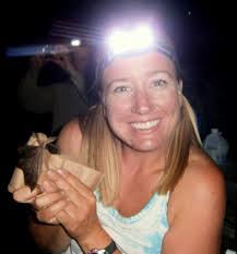Katie Gillies holding a bat (photo: Bat Conservation International) - P8300024