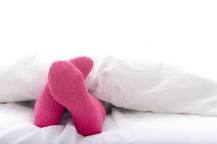 Is it unhealthy to sleep with socks on?