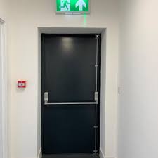 This flat bar retracts a latch mechanism when pushed, unlocking the door for fast exit. Fire Exit Doors Vs Fire Doors The Differences Latham S