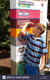 a boy seven 7 years old measures himself against the height