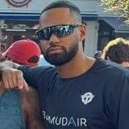 Alumnus Omari Tucker ('16) proudly represented Bermuda at the DC  Half-Marathon with the Grateful Miles Running Club, joining 13 fellow  runners in showcasing island spirit and athletic excellence