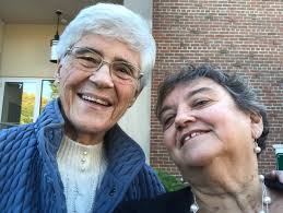 Can you provide the name of the classmate whose husband took the photo?