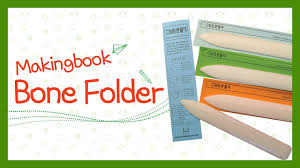 Firmly press the point down while pulling it along the ruler's edge. How To Use Your Bone Folder Youtube