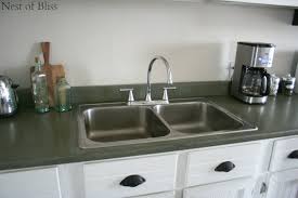 It is extremely durable, and is a timeless material that will continue to look great in your kitchen for years to come. Remodelaholic How To Spray Paint Faux Granite Countertops