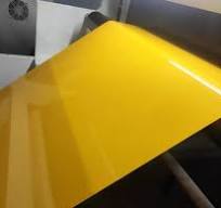 How are colored PET plastic sheets produced?