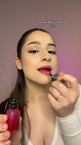 Your lips deserve love 💞 @kat_evangelou wears our skin-loving PhD Hybrid  Lip Oil in ‘Primary’ for a sheer wash of non-sticky color with high-shine,  Pick up #VDay-inspired lippies