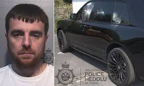 Jealous father who smashed stranger's £300,000 Rolls-Royce SUV with a  shovel in drunken rampage 'driven by envy' is jailed for 30 months