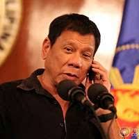 Congressman Dan Lungren (R-California) speaks during the commissioning  ceremony for the Oliver Hazard Perry class guided missile frigate USS JOHN  A. MOORE (FFG 19). Seated behind him is Captain David Kalb, Supervisor