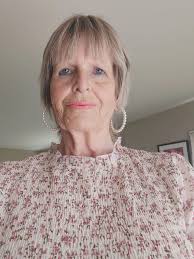 What hairstyle and color would suit a 72-year-old woman with no grey hair?