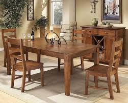 A new rubberwood table features a topper that divides a kitchen table from a surface completely customized for board games. Intercon Solid Rubberwood Dining Set Scottsdale Insc4278set
