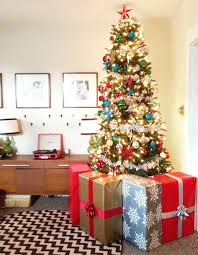 Large Fake Presents To Protect The Tree From Baby Much Prettier Than A Baby Gate Would Hav Hand Christmas Tree Christmas Tree Gate Christmas Tree Decorations