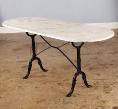 White Marble Bistro Table With A Pair Of Black Wrought Iron Legs Marble Top Bistro Table Bistro Table Marble Bistro Table Bistro Dining Table