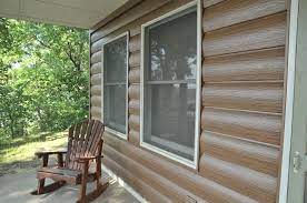 Wainscoting provides a rustic touch. Log Siding Steel Home Siding Abc Seamless