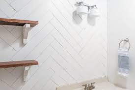 Chevron pattern makes a big impact in this small space! How To Diy A Herringbone Wood Wall On A Budget Lovely Etc