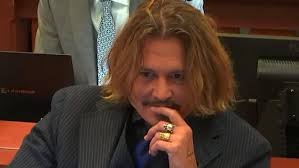Johnny Depp laughs at his childhood friend who takes the stand