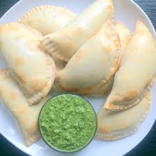 You can eat these as is or serve with a spicy chipotle cream sauce for dipping. Smoky Cheesy Chicken And Spinach Empanadas With Chimichurri Dipping Sauce A Fork In Each Hand