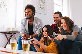 Group Of Happy Young Friends Playing Video Games At Home Playing Video Games Video Games Friends Photography