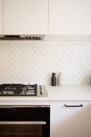 From divine black to splashy yellow, anything goes. Red Lily Renovations A Herringbone Tile With Grey Grout Helps To Add Some Interest To An All White Kitchen Facebook