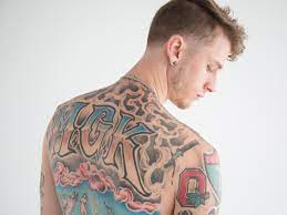Machine Gun Kelly: The Guy Whose Tattoos You'll Be Seeing Everywhere This  Summer 